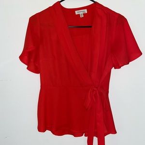 Red blouse, tie at waist